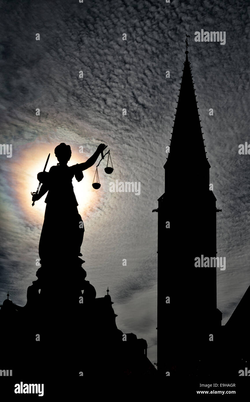 Justitia statue in front of the silhouette of the Old St. Nicholas Church, Frankfurt am Main, Hesse, Germany Stock Photo