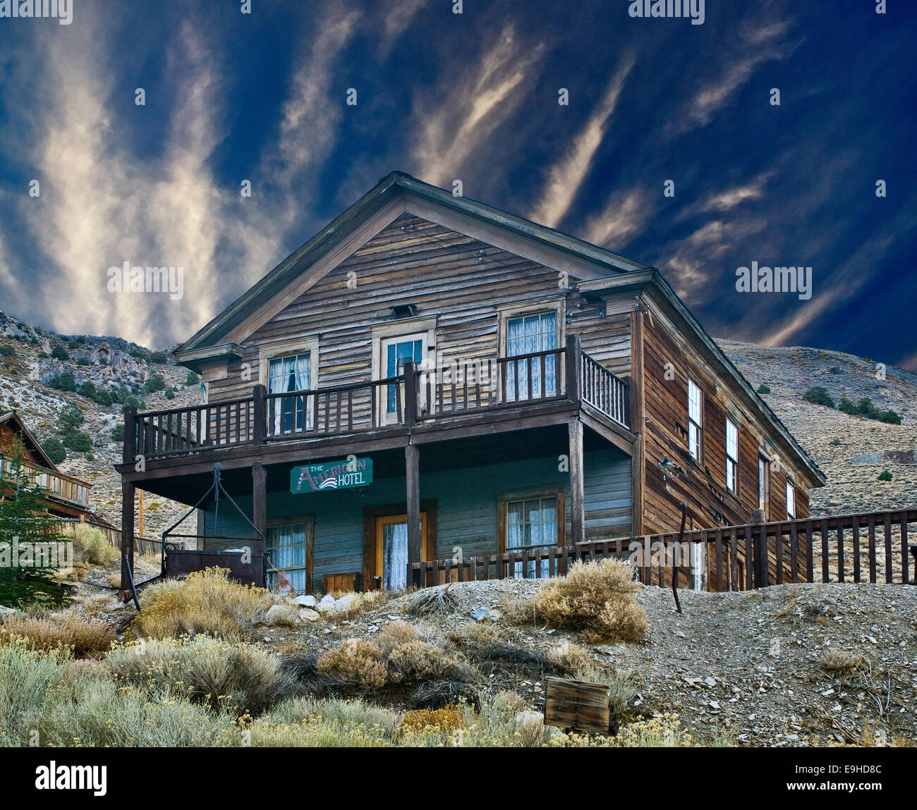 Abandoned American Hotel in Cerro Gordo ghost town at Cerro Gordo Road, Inyo Mountains over Owens Valley, California, USA Stock Photo