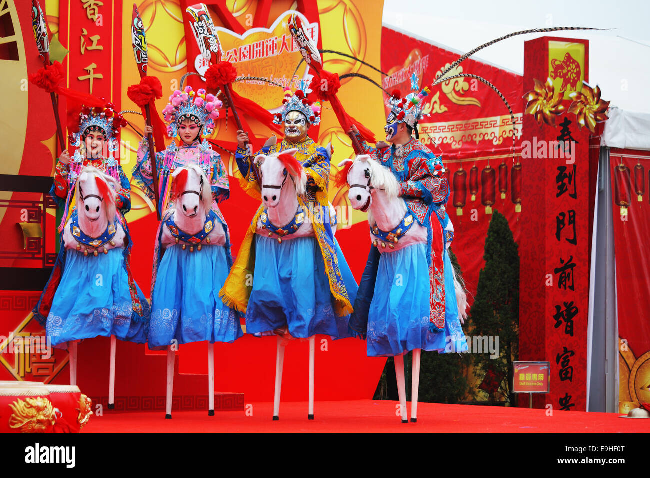 Beautiful dancers on stilts depict riders Stock Photo Alamy