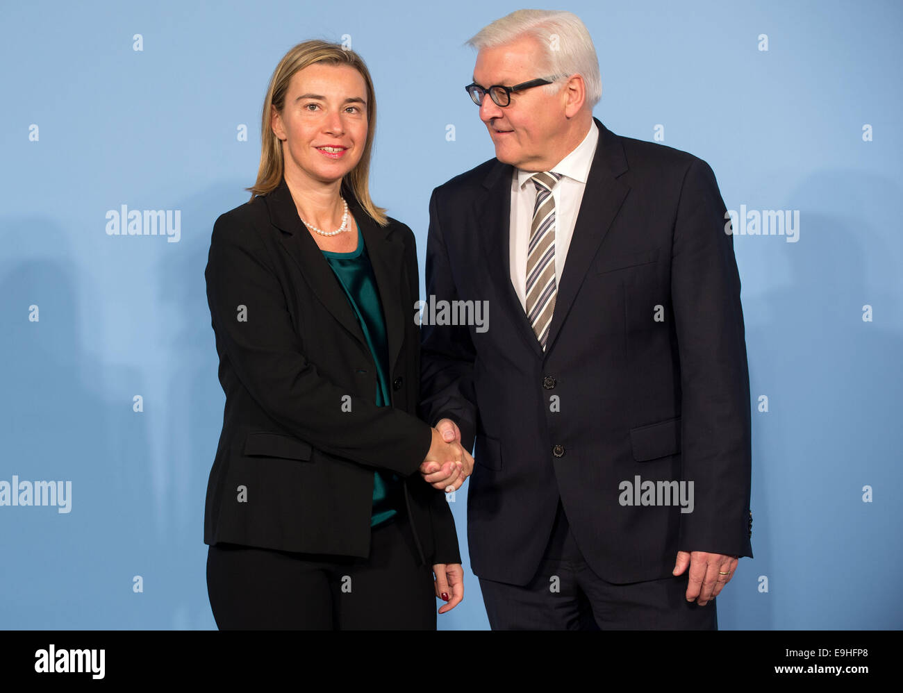 German Foreign Minister Frank-Walter Steinmeier (R) welcomes Federica Mogherini, the Italian Foreign Minister, to the conference on the current refugee situation in Syria and neighboring countries in the Foreign Office in Berlin, Germany 28 October 2014. Photo: TIM BRAKEMEIER/dpa Stock Photo