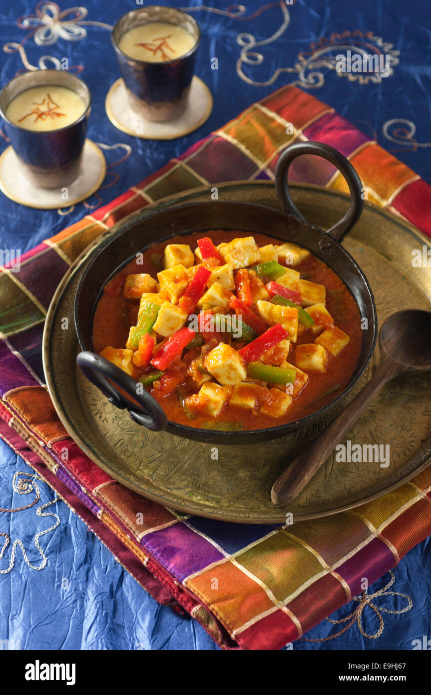 Paneer jalfrezi. Vegetarian curry with Indian cheese, tomatoes and peppers. Stock Photo