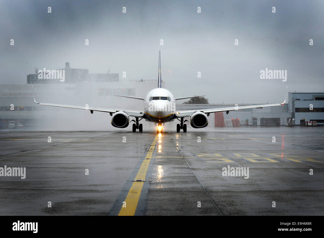 A Ryanair Boeing 737 taxis towards the main runway at Glasgow Airport. Stock Photo