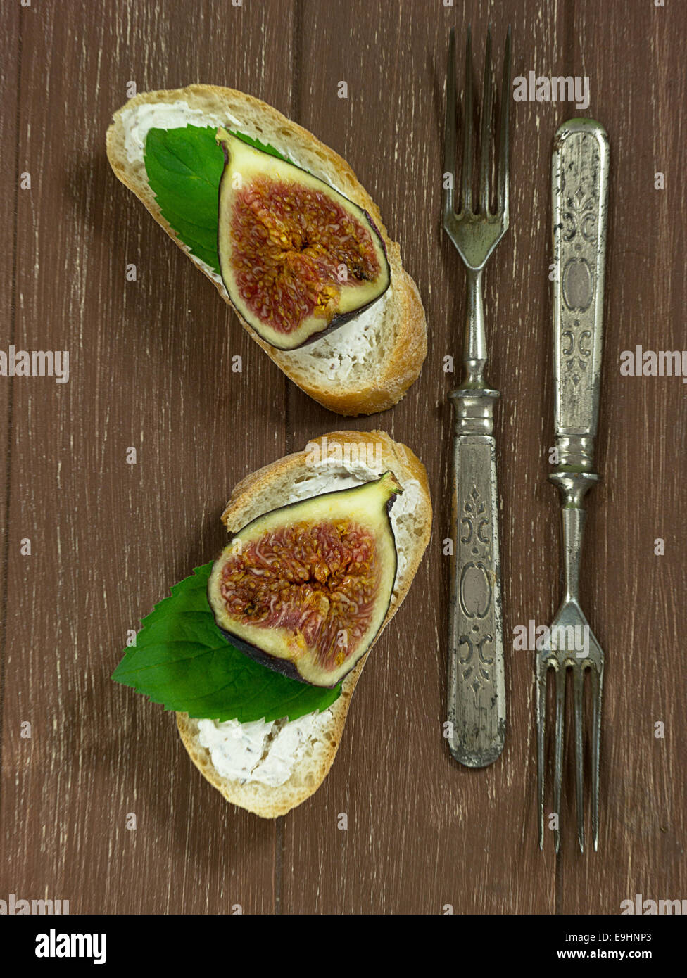 Fresh figs on baguette with Walnusfrischkäse Stock Photo