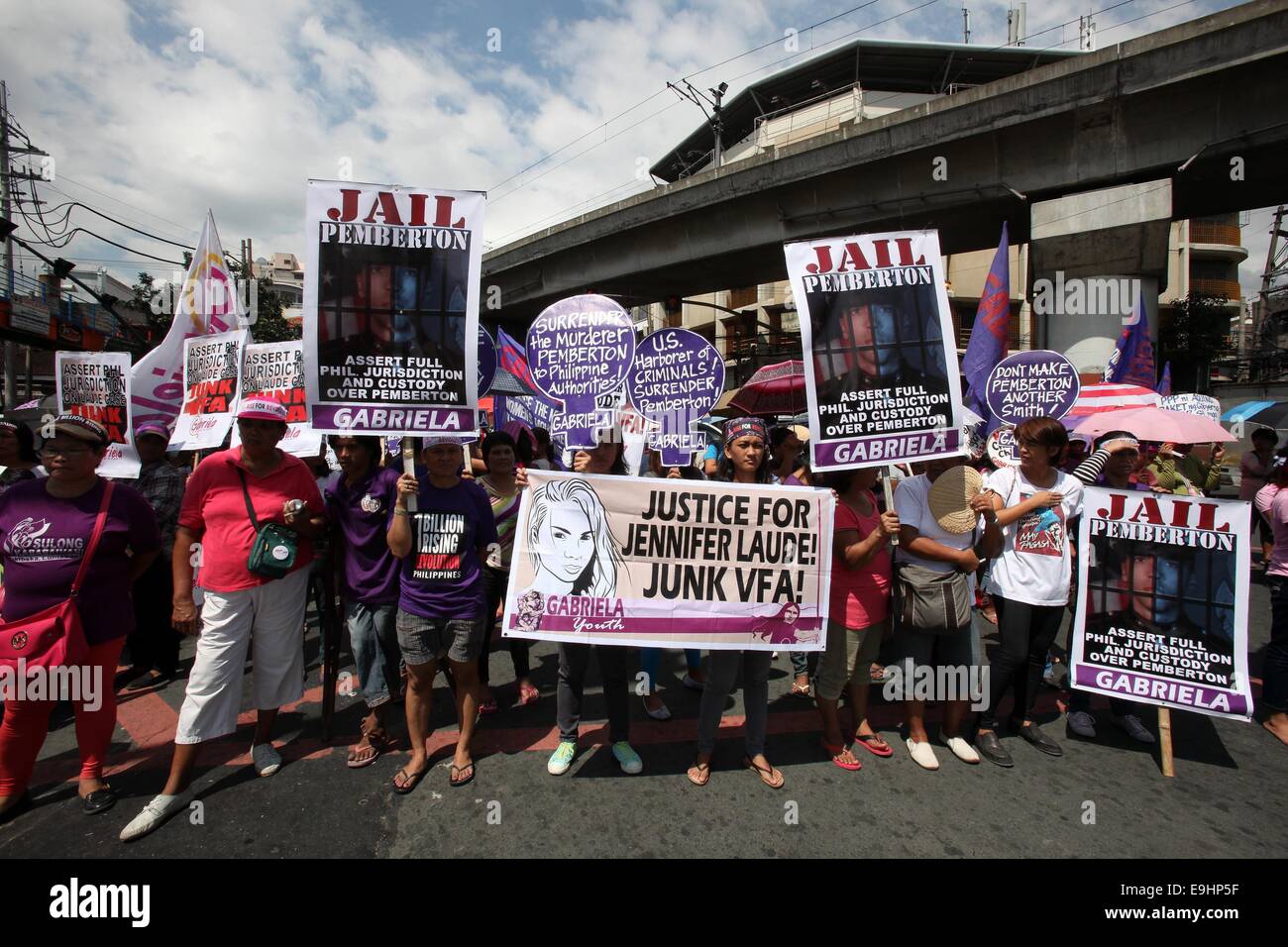 Manila, Philippines. 28th Oct, 2014. Activists hold placards during a protest rally near the Malacanan Palace in Manila, Philippines, on Oct. 28, 2014. The protesters called for the junking of the Enhanced Defense Cooperation Agreement (EDCA) and demanded justice for Filipino transgender Jeffrey 'Jennifer' Laude who was allegedly killed by U.S. Marine Private First Class Joseph Scott Pemberton. Credit:  Rouelle Umali/Xinhua/Alamy Live News Stock Photo