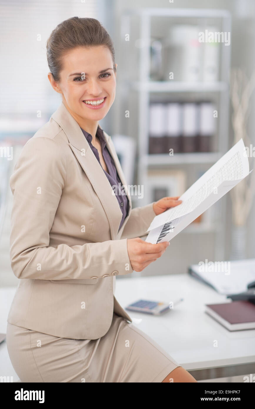 Happy business woman working with documents in office Stock Photo - Alamy