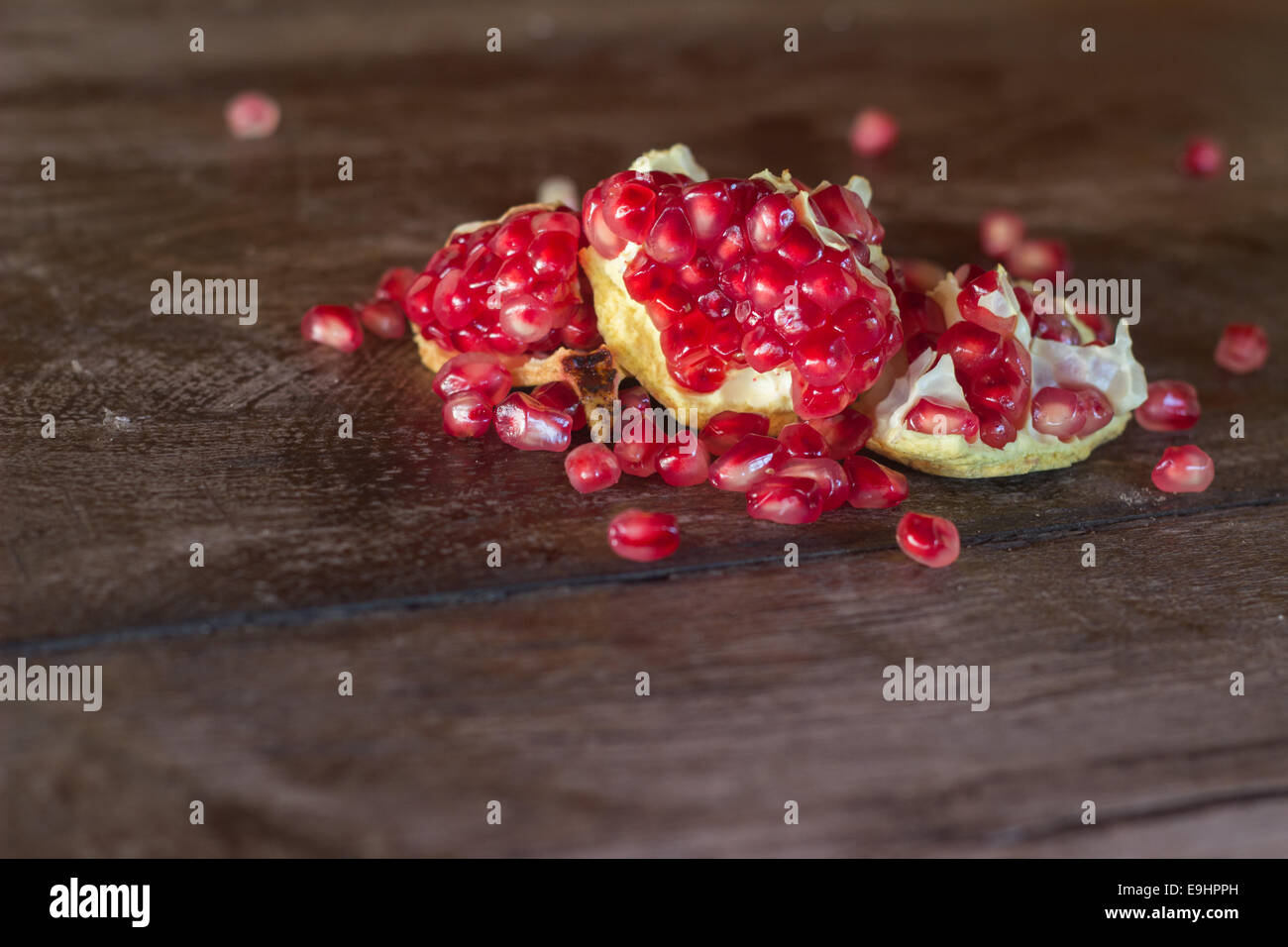 pomegranate seeds red ripe wood wooden 'copy space' Stock Photo