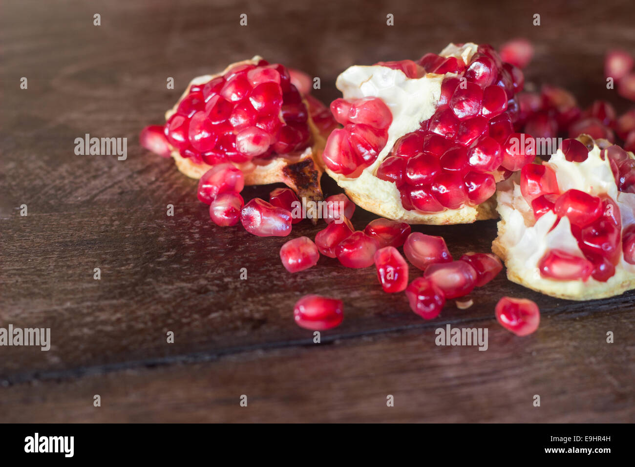 pomegranate seeds red ripe wood wooden 'copy space' Stock Photo