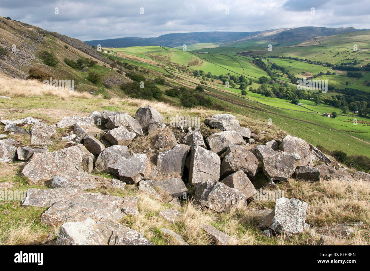 Cracken edge quarries near Chinley in Derbyshire. Gritstone rocks in foreground, view toward Kinder Scout. Stock Photo