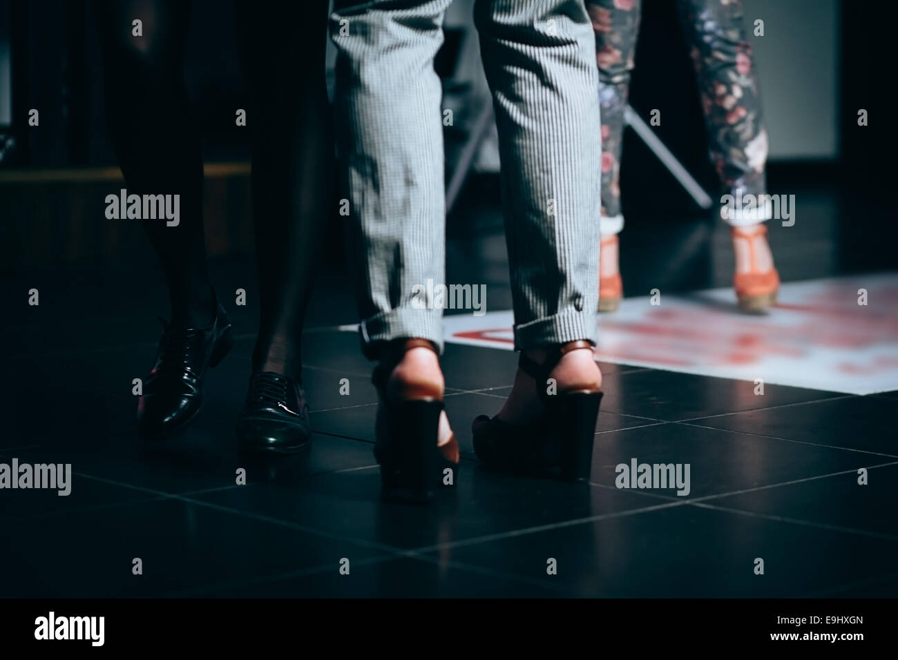 Dancing legs on the floor of night club. Shallow depth of field Stock Photo