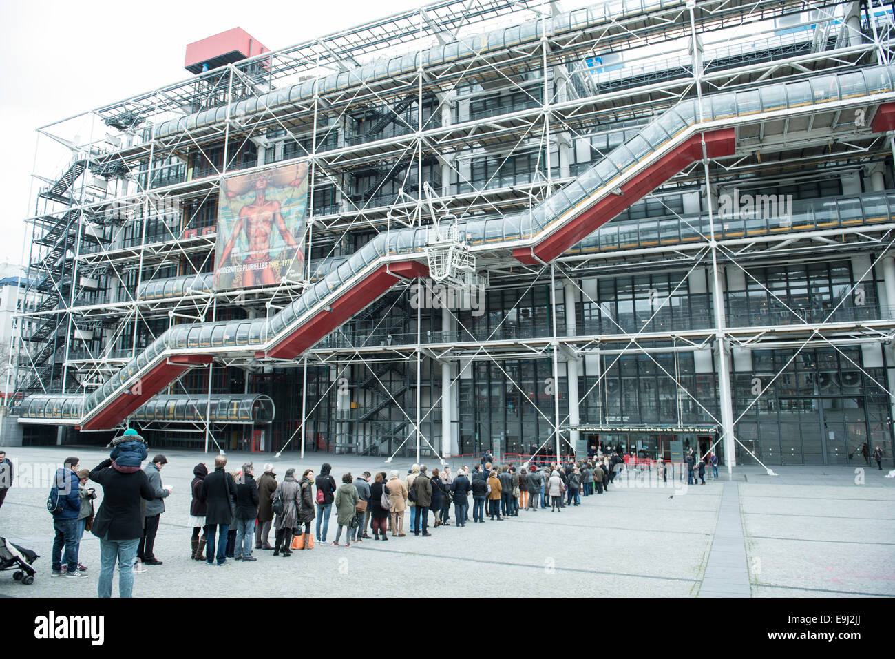 tourists and french people queuing outside the Centre Georges Pompidou in France's capital city Paris waiting to go into the art gallery and museum Stock Photo