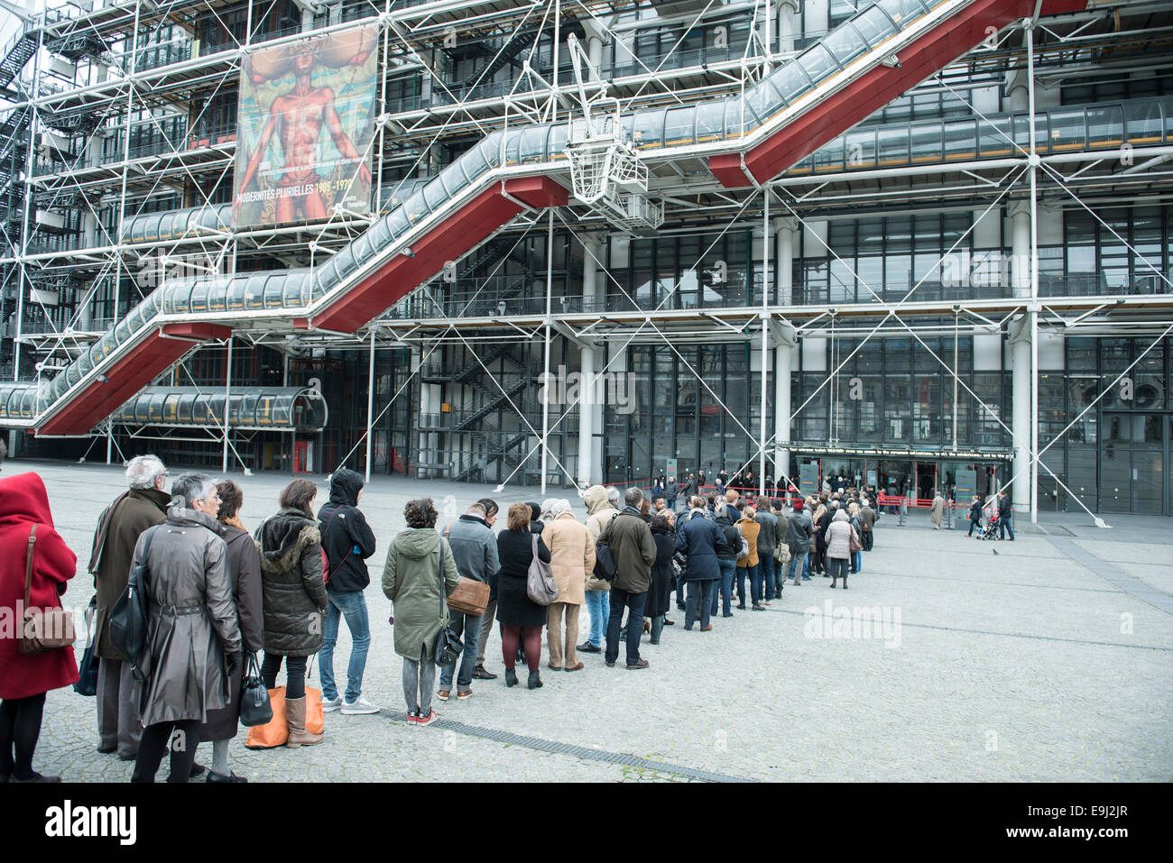 tourists and french people queuing outside the Centre Georges Pompidou in France's capital city Paris waiting to go into the art gallery and museum Stock Photo