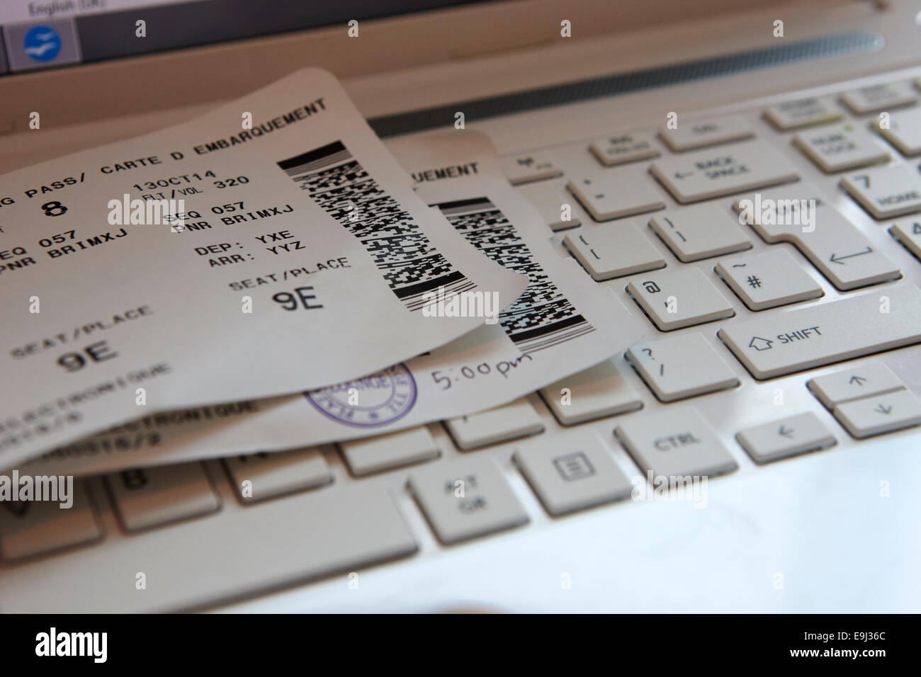 boarding cards and laptop in airport business lounge in canada Stock Photo Alamy