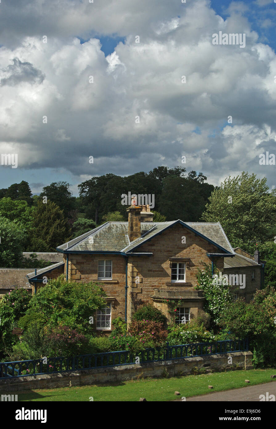 Stone built house in the Derbyshire village of Edensor. Stock Photo