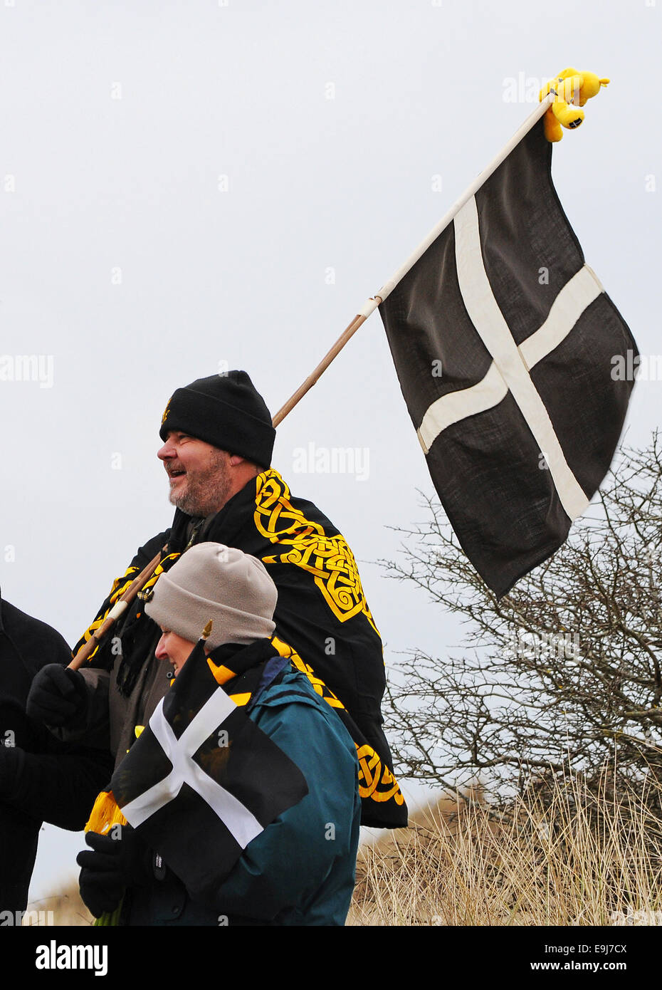 People carrying the Cornish flag on St. Pirans day in Cornwall, UK Stock Photo