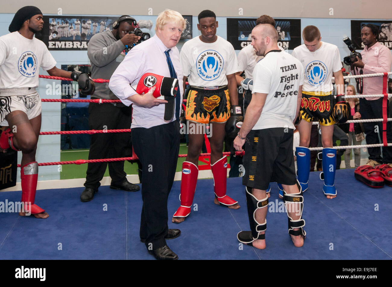 London, UK. 28th October, 2014. The Mayor of London, Boris Johnson visited a training session at Fight for Peace Academy in North Woolwich, Newham where he met some of the young people being helped by the charity. Fight for Peace uses boxing and martial arts combined with education and personal development to realise the potential of young people in the borough at risk of crime and violence.  First established in Rio in 2000 by Luke Dowdney MBE, it was replicated in Newham in 2007and is now expanding globally.  Pictured :  the Mayor in the ring.   Credit:  Stephen Chung/Alamy Live News Stock Photo