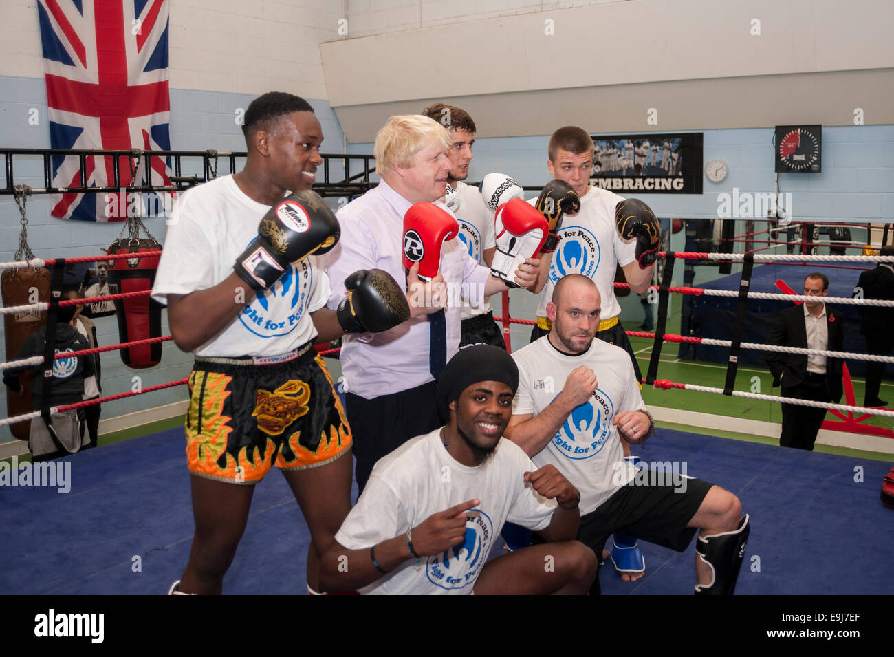 London, UK. 28th October, 2014. The Mayor of London, Boris Johnson visited a training session at Fight for Peace Academy in North Woolwich, Newham where he met some of the young people being helped by the charity. Fight for Peace uses boxing and martial arts combined with education and personal development to realise the potential of young people in the borough at risk of crime and violence.  First established in Rio in 2000 by Luke Dowdney MBE, it was replicated in Newham in 2007and is now expanding globally.  Pictured :  the Mayor in the ring.   Credit:  Stephen Chung/Alamy Live News Stock Photo