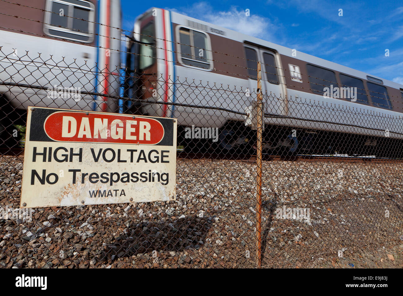 HIgh voltage danger sign on Metrorail fence - Virginia USA Stock Photo