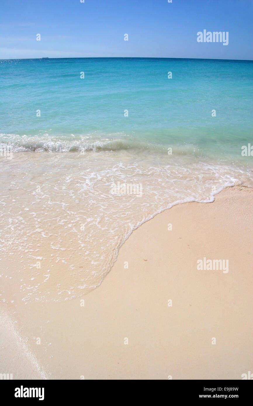 Beautiful white sand beach with turquoise sea & blue sky, Manchebo Beach, Aruba, Caribbean. Stock Photo