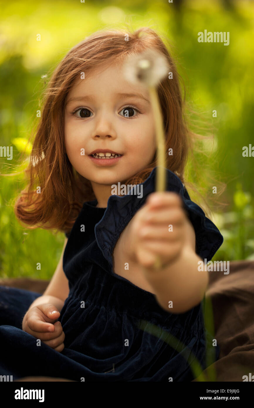Little girl with dandelion Stock Photo - Alamy