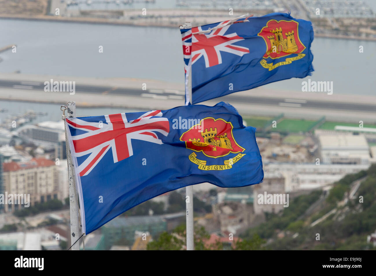 State ensign of Gibraltar flags flying in Gibraltar Stock Photo Alamy