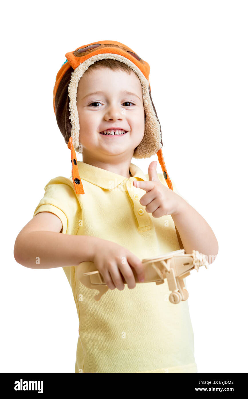 happy child boy dressed pilot hat and playing with wooden airpla Stock ...