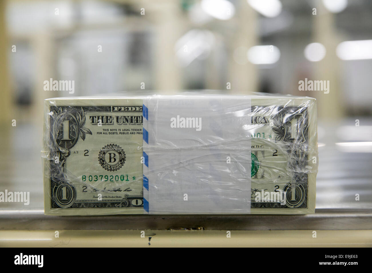Bundles of United States One Dollar ($1) bills during production at the Bureau of Engraving and Printing in downtown Washington, Stock Photo