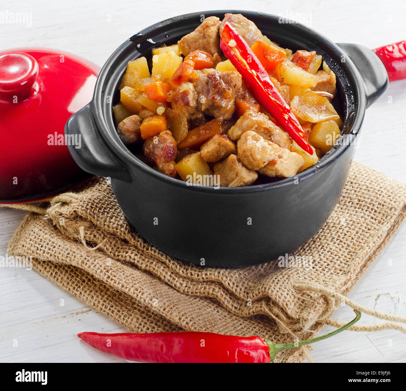 Vegetable and meat stew with chili peppers. Stock Photo