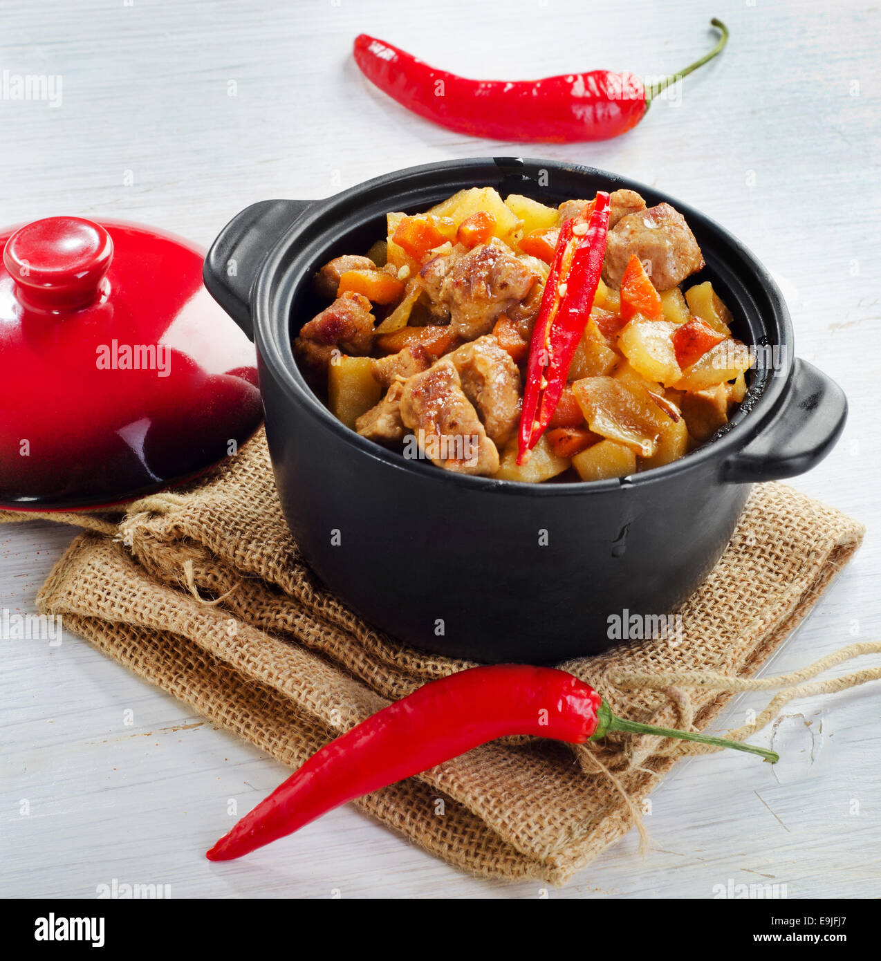 Vegetable and meat stew with chili peppers. Stock Photo