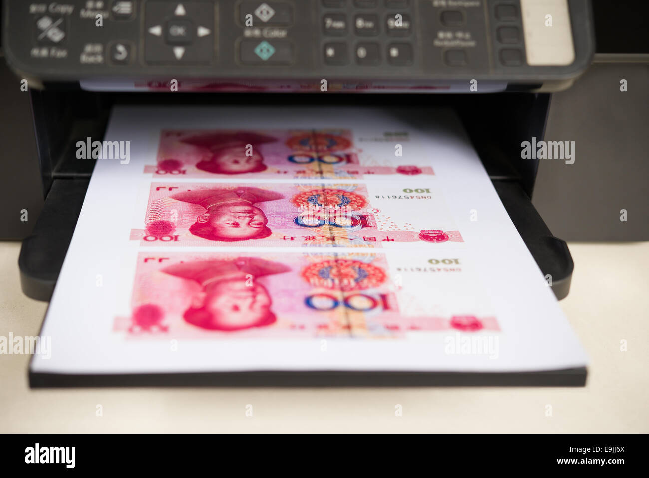 printer with RMB paper currency coming out Stock Photo