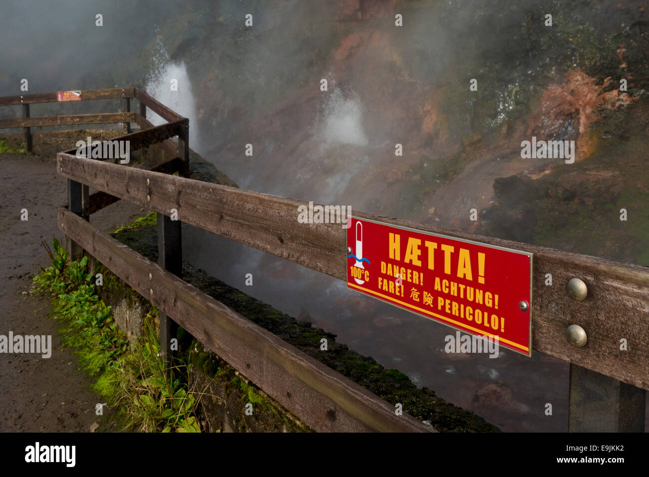 Warning sign on a fence, hot spring Deildartunguhver, highest-flow hot spring of Iceland with 180 liters of boiling water per Stock Photo