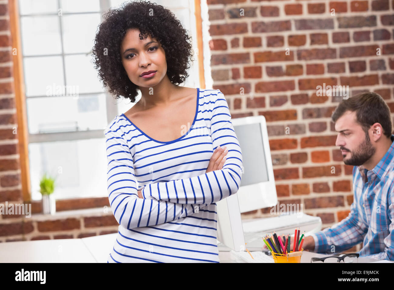 Portrait of smiling businesswoman in office Stock Photo - Alamy