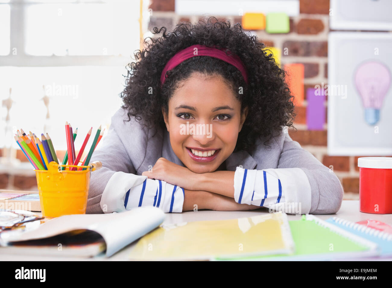 Portrait of female interior designer at desk Stock Photo