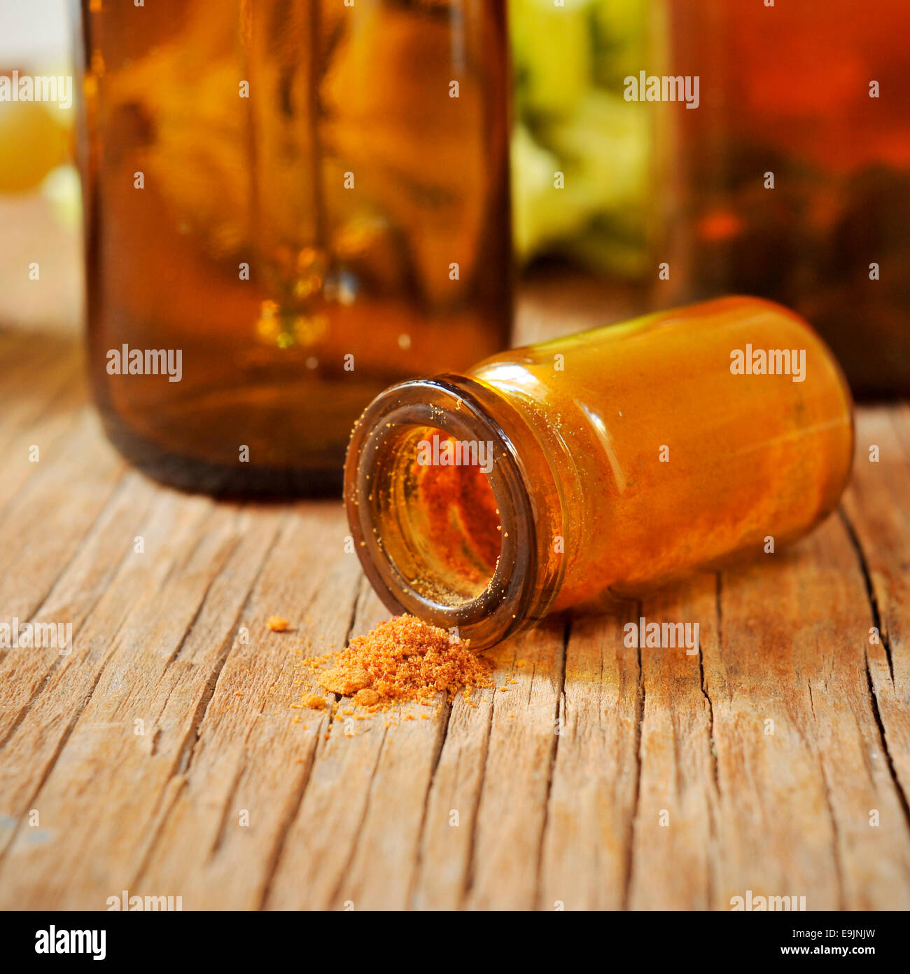 closeup of a bottle with dehydrated royal jelly on a rustic wooden table Stock Photo