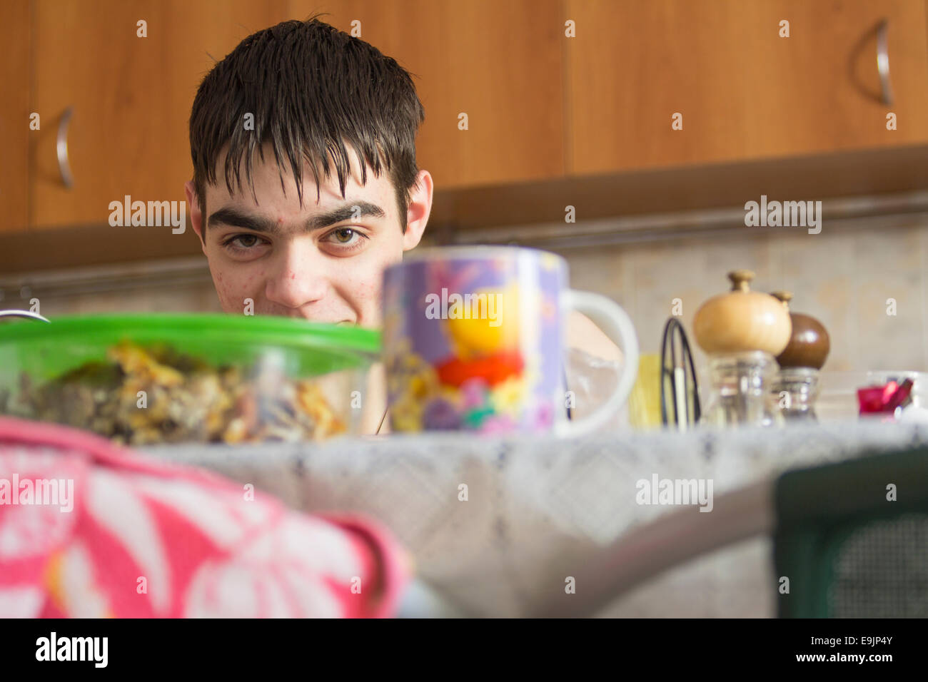 Portrait young man table hi-res stock photography and images - Alamy