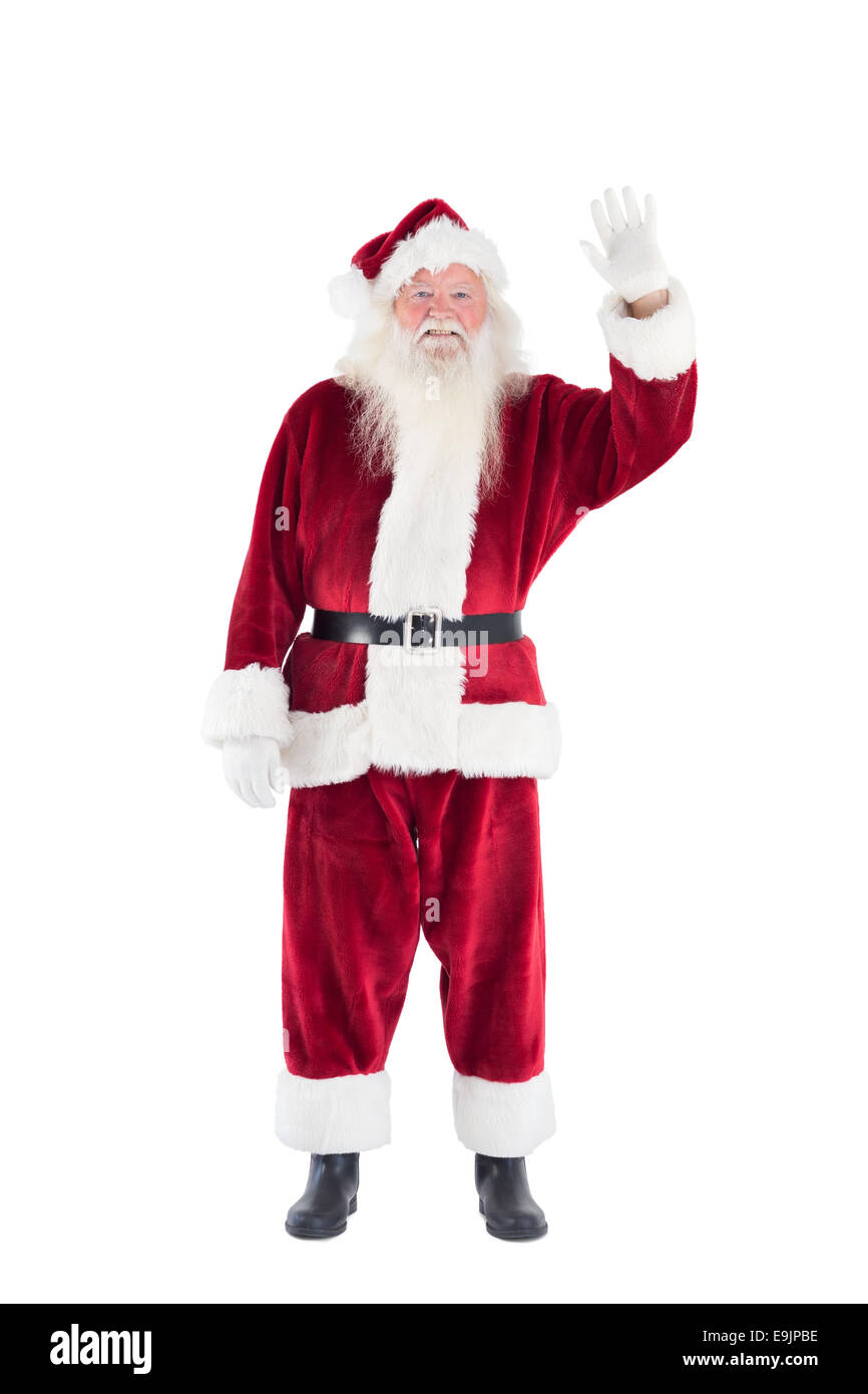 Jolly Santa waving at camera Stock Photo