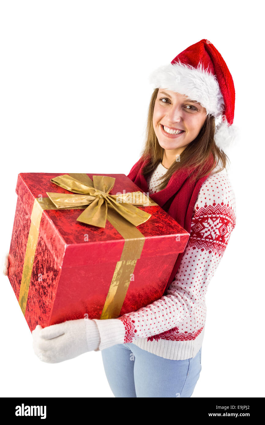 Young woman holding a gift while smiling at camera Stock Photo - Alamy