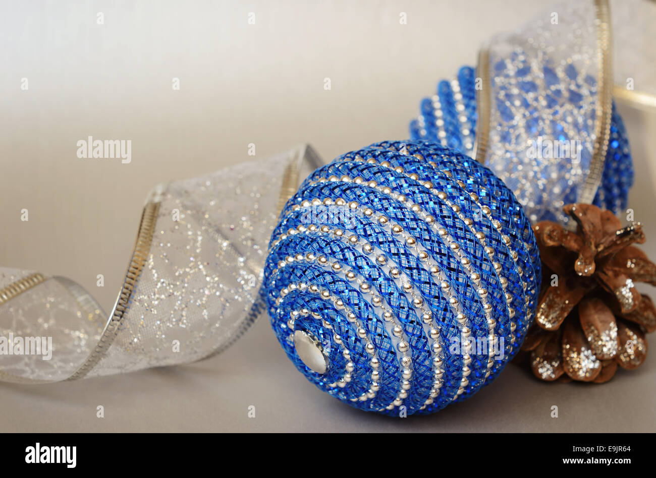Christmas balls and pine cone on a silver background Stock Photo - Alamy
