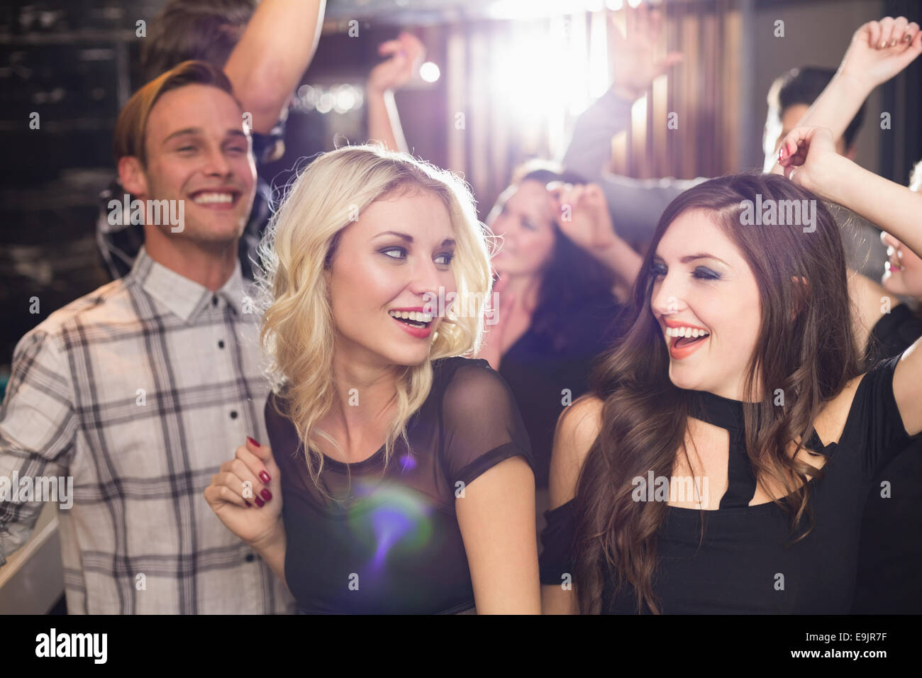 Stylish friends dancing and smiling Stock Photo - Alamy