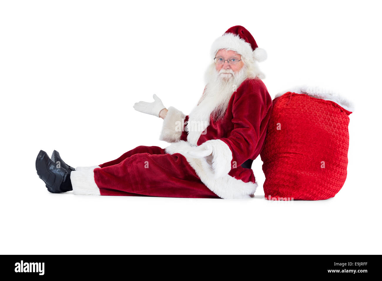Santa sits leaned on his bag and has no clue Stock Photo