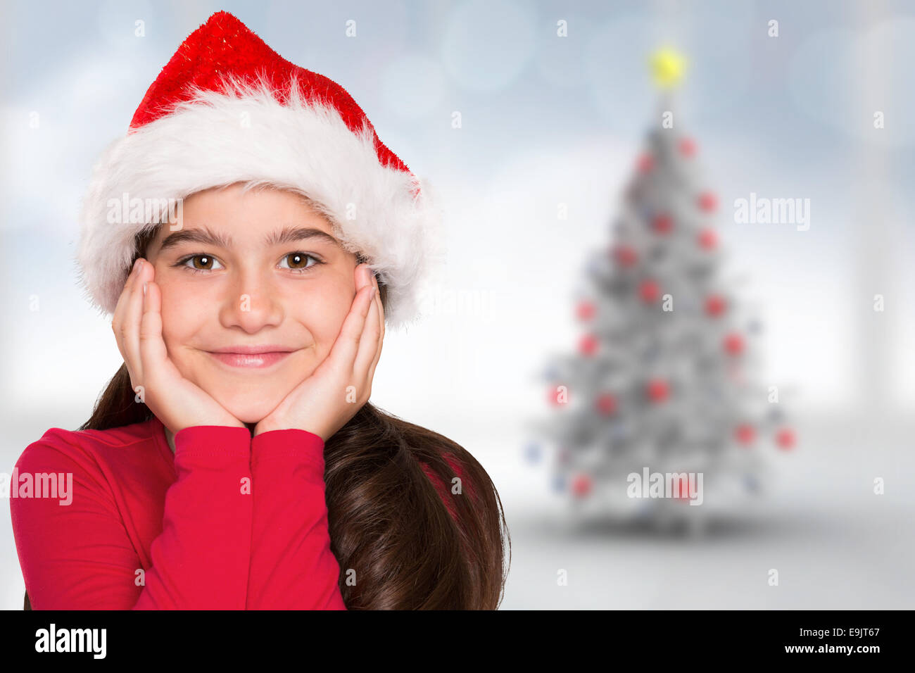 Composite image of festive little girl smiling at camera Stock Photo ...
