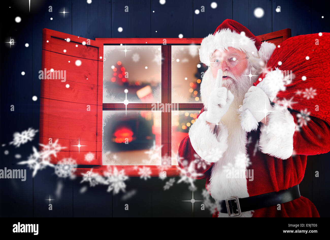 Composite image of santa claus carrying sack Stock Photo - Alamy