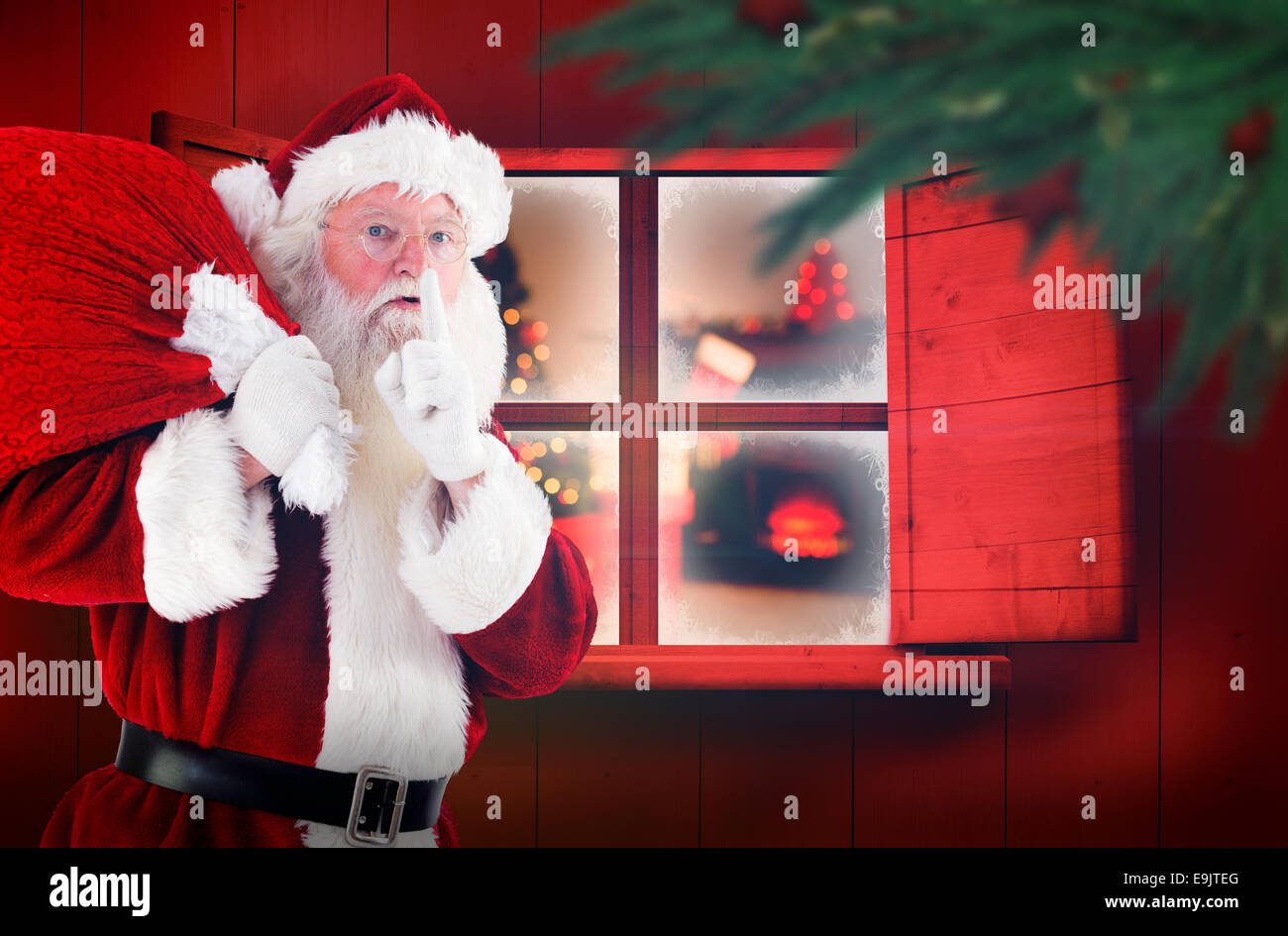 Composite image of santa claus carrying sack Stock Photo - Alamy