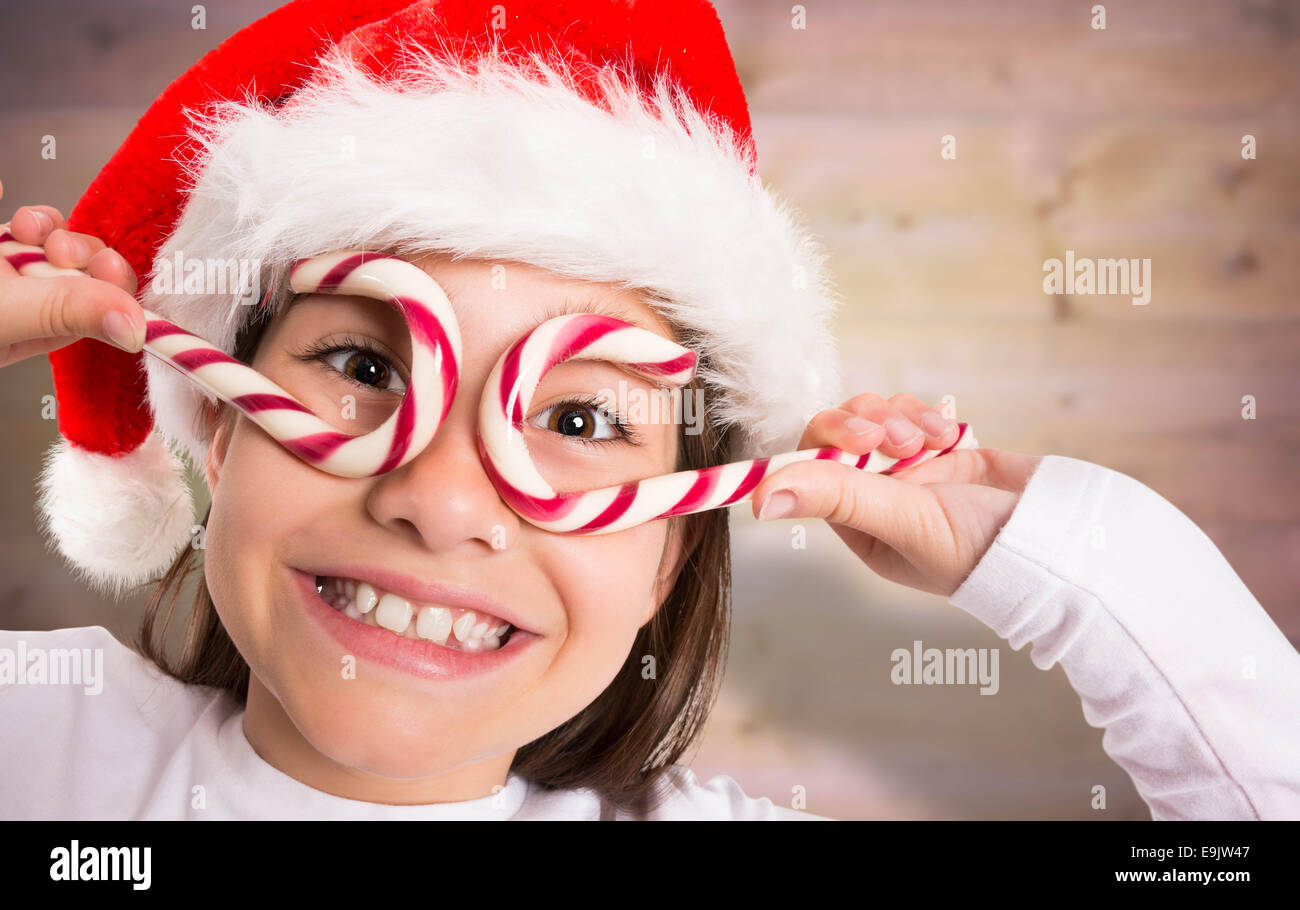 Composite image of festive little girl smiling at camera Stock Photo ...