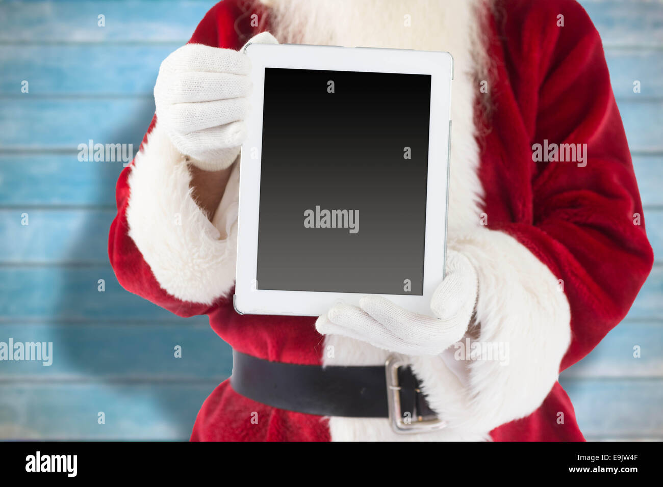 Composite image of santa claus showing tablet pc Stock Photo - Alamy