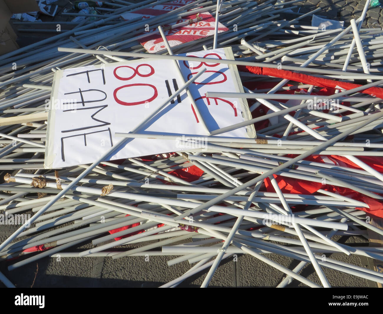 ROME, ITALY - OCTOBER 25, 2014: Flags of the workers of CGIL labor union ababndoned after the protest in San Giovanni square Stock Photo