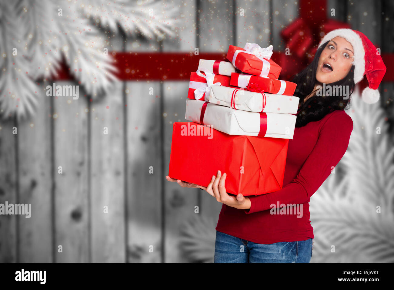https://c8.alamy.com/comp/E9JWKT/composite-image-of-woman-holding-many-christmas-presents-E9JWKT.jpg