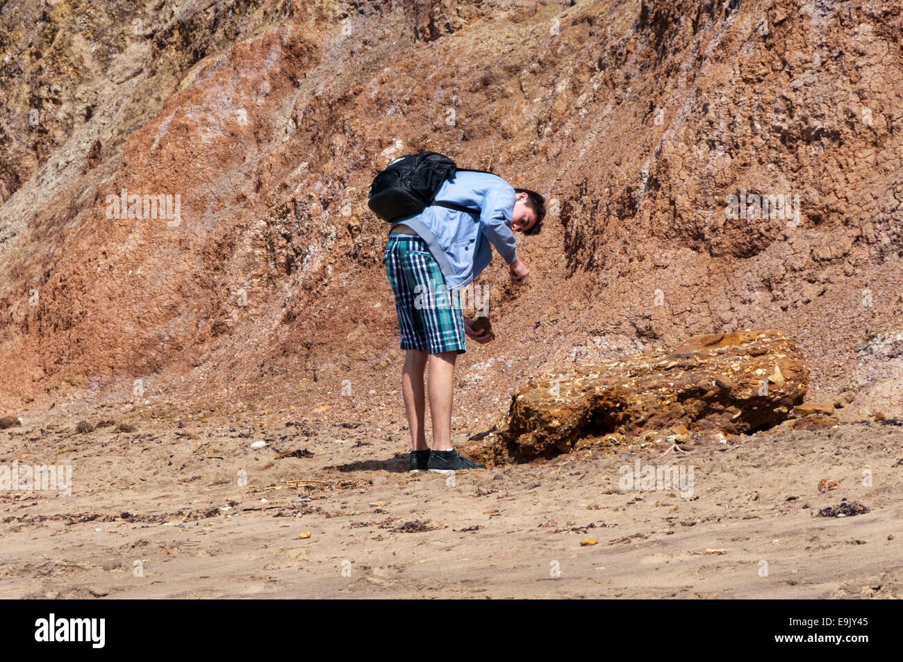 Fossil hunter on the beach at Brook Bay, Isle of Wight. Stock Photo