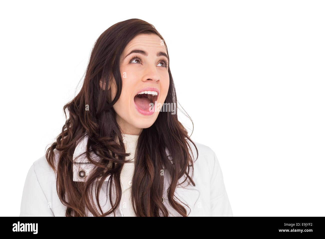 Beauty brown hair in white coat screaming Stock Photo