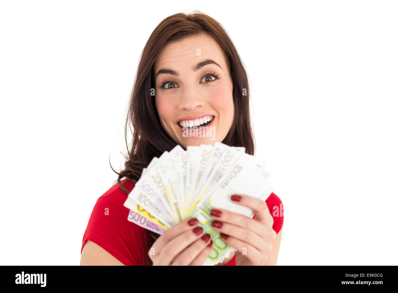 Pretty brunette holding her cash Stock Photo - Alamy