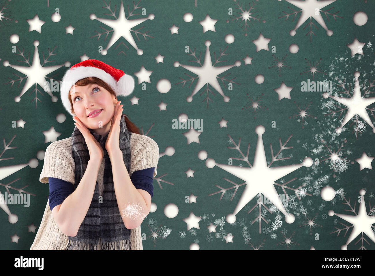 Smiling woman wearing santa hat Stock Photo - Alamy